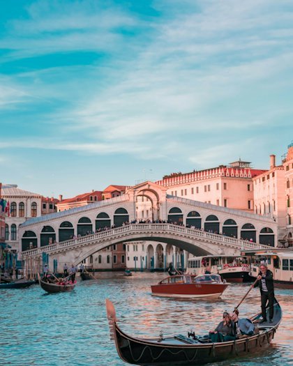Gondolas moored beside the Rialto bridge in Venice